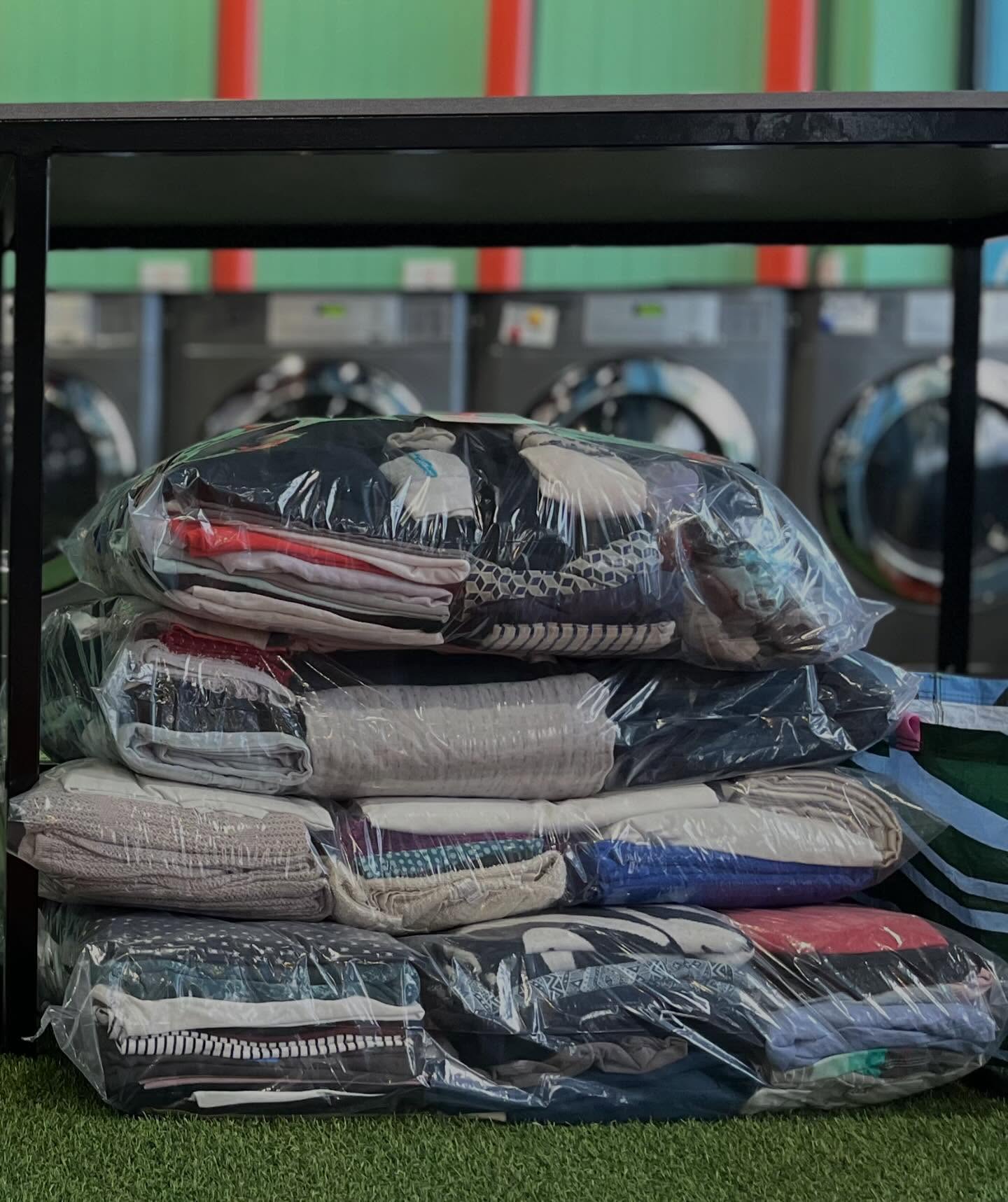 Neatly arranged laundry bins at My Laundry Lounge